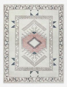 a green and white rug with an intricate design on the bottom, surrounded by smaller geometric shapes