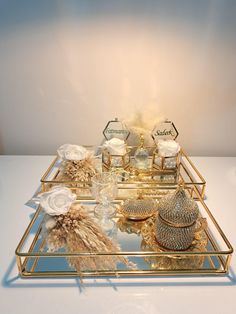 a gold tray with various items on it