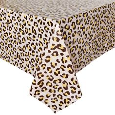 a leopard print tablecloth on top of a white table