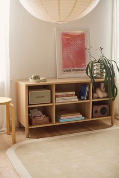 a wooden shelf with books and other items on it