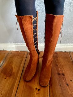 Original 1960s rust brown suede lace up boots. Lace up on both sides, very special and unique. Beautiful classic 1960s shape. The condition is perfect and the boots are unworn. Size 7 N stamped. I would say they are suitable for a Euro 38. Please check the measurements: outsole length 24.5 cm, heel 4.5 cm. I prefer insured shipping but ask for cheaper shipping rates if you don't want any insurance (on your own risk). Brown Boots With Front Lace-up Fastening For Fall, Fall Brown Boots With Front Lace-up Fastening, Vintage Knee-high Lace-up Boots For Fall, Vintage Brown Lace-up Heeled Boots, Brown Suede Lined Lace-up Boots For Fall, Retro Suede Boots For Fall, Brown Suede Lace-up Hiking Boots, Vintage Brown Lace-up Boots, Vintage Brown Lace-up Winter Boots