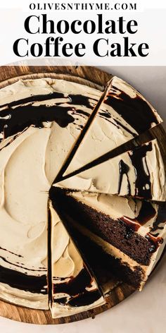 a chocolate cake with white frosting on a wooden platter that is cut into slices