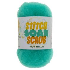 a green ball of yarn with the words stitch soak scrub on it's side