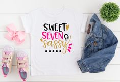 a t - shirt with the words sweet seven and sasy on it next to some shoes