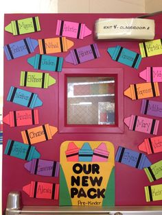 a classroom door decorated with post it notes that say our new pack on the front