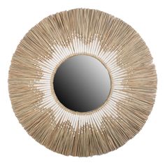 a round mirror that is made out of straw