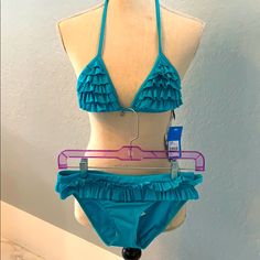 Nwt Aussie Brand Hipster Bikini In Gorgeous Teal Color. 2 Rows Of Tiny Ruffles Adorn The Hipster Bottoms And The Triangle Top Is Ruffle Upon Ruffle Item With Strings In The Back. Neck Tie Has Tiny Silver Beads. Very Nice Bikini That Will Stand The Test Of Time. All Eyes On You In This Stunner Vacation Swimwear With Ruffles And Tie-side Bottom, Blue Ruffled Straps Swimwear, Ruffled Tie-side Swimwear For Beach, Beach Swimwear With Ruffles And Tie-side Bottom, Color Block Swimwear, V-neck Ruffled Swimwear For Beach, Ruffled Tie-side Bottom Swimwear, Nice Bikinis, Halter Swim Top