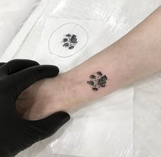 a person's arm with a paw print on it