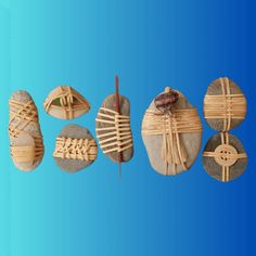 four different types of wooden objects on rocks