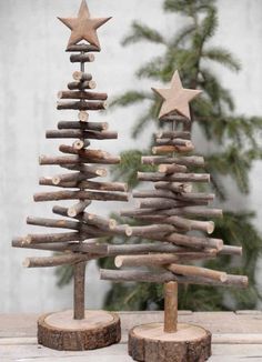 a small wooden christmas tree sitting on top of a table