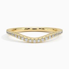 a yellow gold wedding band with white diamonds