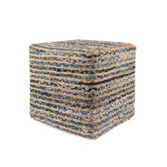 a blue and brown striped ottoman sitting on top of a white floor