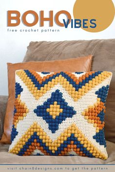 the cover of boho vibes magazine featuring a pillow on a couch with an orange and blue pattern