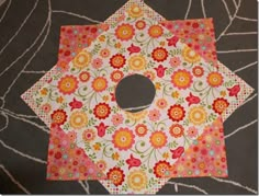 a circular piece of fabric with flowers on it