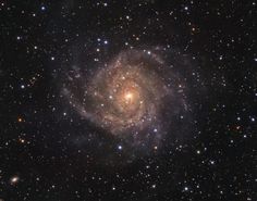 an image of a spiral galaxy in the sky