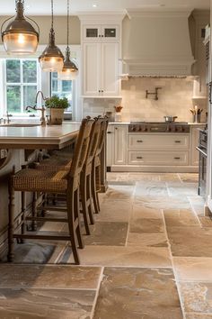 a kitchen filled with lots of counter top space next to a stove top oven and refrigerator