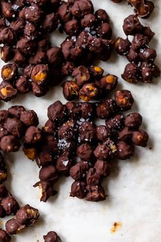 pieces of chocolate coated fruit sitting on top of a counter