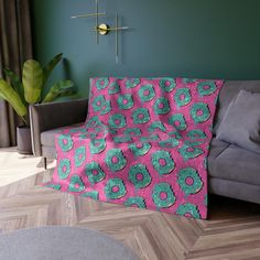 a living room with a gray couch and green wall