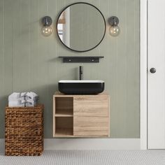 a bathroom with a sink, mirror and basket on the floor in front of it