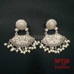 Chandni Silver Oxidized Pearl Chandbali Earrings Made in Brass with Oxidized Silver Finish and Pearls Very Elegant and stylish, these earrings can be paired with any traditional Indian or Western Attire depending upon the occasion and the theme. Length: Approx. 2.25 Inches Light-weight Earrings with hook hanging feature for earlobes In-stock & ready-to-ship **Color may vary slightly due to photography and lighting. Pick-up available for this item at 5336 Heather Brook Ln. Glen Allen, 23059, Virg Luxury Silver Fusion Chandbalis, Luxury Silver Chandbalis With Pearl Drop, Studs Indian, Chandbali Earrings, Trendy Earrings, Oxidized Silver, Traditional Indian, Light Weight Earrings, Stone Color