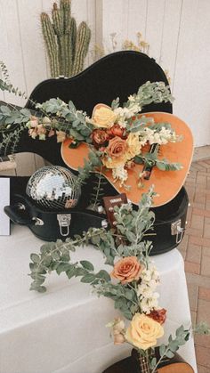 Boho, mustard, rust, music, guitar, floral, wedding florals, disco Spain Theme Wedding, Guitar Themed Wedding, Guitar Decoration Ideas, Guitar Decorating Ideas, Bridal Shower Music Theme, Elvis Bridal Shower Ideas, Guitar Wedding Ideas, Spain Bridal Shower Theme, Music Theme Table Decor