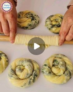 the video shows how to make spindles out of dough and rolled them into buns