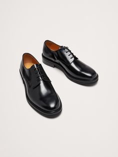 The perfect dress shoe, these timeless leather derby shoes have a minimalist design, beautifully crafted for us in Portugal of exceptional, Italian leather.  Italian leather uppers and leather lining.  Blake-stitched rubber lug soles.  Premium foam cushioned footbed.  Lace up closure.  Made in Portugal.  Whole and half sizes. Classic Oxfords For Office With Stitched Sole, Classic Office Oxfords With Stitched Sole, Masculine Oxfords For Derby With Stitched Sole, Derby Oxfords With Stitched Sole, Classic Lace-up Shoes With Stitched Sole For Business, Business Derby With Stitched Sole And Plain Toe, Timeless Oxfords With Stitched Sole For Office, Plain Toe Oxfords With Stitched Sole For Work, Masculine Goodyear Welted Oxfords For Workwear