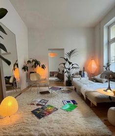 a living room filled with lots of furniture and plants on the floor in front of a mirror