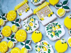 decorated cookies with lemons and leaves on them