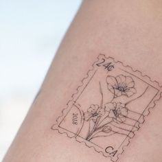 a stamp with some flowers on it and the word love is written in cursive writing