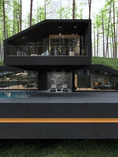 a modern house in the middle of a forest with a swimming pool and patio area