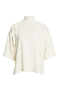 Deconstructed ease defines a mock-neck knit top fashioned in a boxy silhouette and framed by elbow-length sleeves. Mock neck Elbow-length sleeves 97% viscose, 3% elastane Hand wash, dry flat Imported White Short Sleeve Knit Top For Work, White Oversized Funnel Neck Top, Oversized White Funnel Neck Top, Oversized Turtleneck Top For Work, Versatile White Turtleneck Top, Chic White Mock Neck Top For Spring, Elegant White Turtleneck Knit Top, Spring White Mock Neck Top For Work, Modern Cream Tops For Workwear