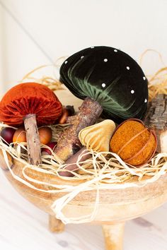 a basket filled with lots of different types of mushrooms