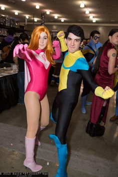 two people in costumes standing next to each other