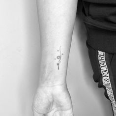 a person with a small tattoo on their arm