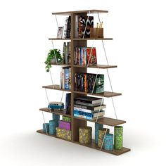 a bookshelf filled with lots of books next to a plant and other items