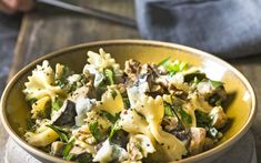 a close up of a bowl of food on a table