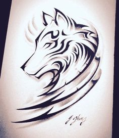 a drawing of a wolf head on a piece of paper