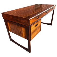 a wooden desk with two drawers on one side and a glass top on the other