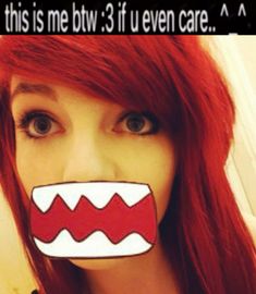 a woman with red hair has a fake mouth