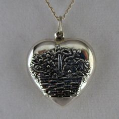 "This antiqued sterling silver, two-sided, puffed repousse Market Basket with Flowers Heart charm features a maple splint basket overflowing with flowers and foilage. Marked, Sterling. Made by Brown County Silver. Vintage and in new, never worn condition. Approximately 30 years old. 1 1/4\" high with jump ring 1\" wide 4.9 grams See more @ https://www.etsy.com/shop/brocosi" Heart Cut Wedding Jewelry With Hallmark, Hallmarked Heart-shaped Jewelry For Weddings, Heart-shaped Hallmarked Jewelry For Wedding, Nickel-free Heart Pendant Wedding Jewelry, Nickel-free Heart Pendant For Wedding, 925 Stamped Heart Pendant For Wedding, Wedding Heart Pendant Jewelry Stamped 925, Wedding 925 Stamped Heart Pendant Jewelry, Antique Heart Necklace For Valentine's Day Wedding