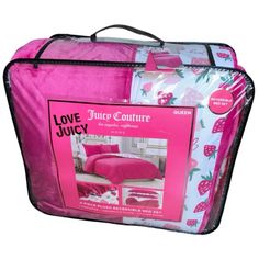 a pink and white bed in a bag with the words love juicy written on it