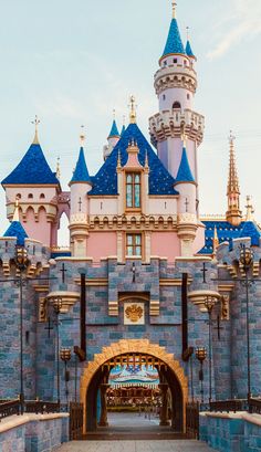 the entrance to sleeping beauty castle at disneyland world