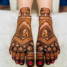 the feet are decorated with henna designs