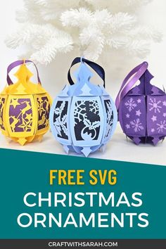 three paper lanterns with the text free svg christmas ornaments on them, in front of a white tree