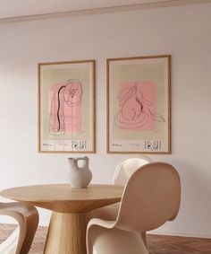 two paintings hang on the wall next to a table with chairs and vases in front of it