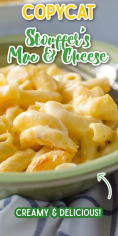 a green bowl filled with macaroni and cheese