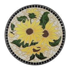 a glass plate with sunflowers painted on it