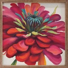 a painting of a large flower in a wooden frame