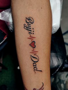 a person with a tattoo on their arm that says, love is all you need